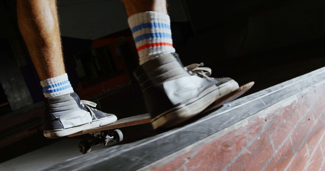 Close-up of Skateboarder Performing Trick at Skate Park Ramp