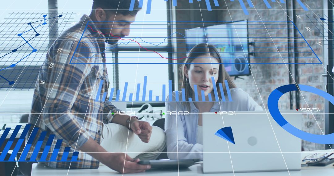 Colleagues Analyzing Data with Digital Chart Overlay in Work Environment