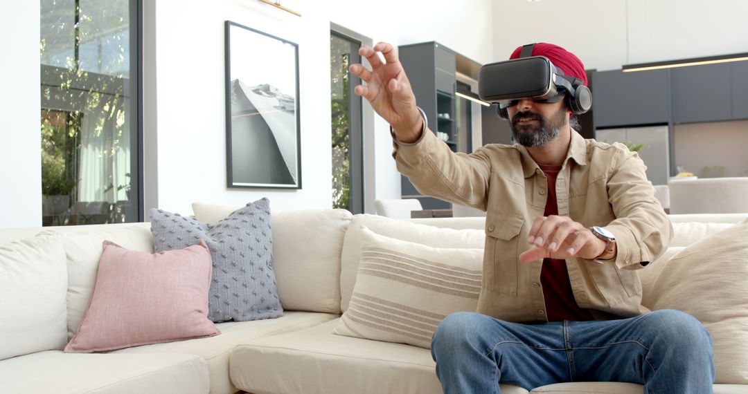 Man Engaging in Virtual Reality Game on Modern Couch