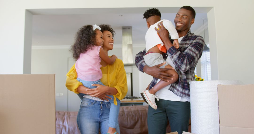 Happy African American family moving into new home with children - Free Images, Stock Photos and Pictures on Pikwizard.com