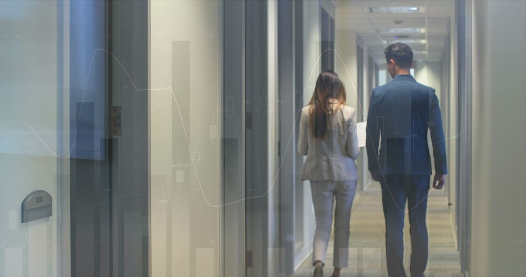 Business Professionals Analyzing Data in Modern Office Corridor