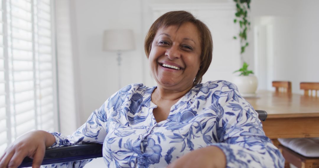 Smiling Senior Woman in Wheelchair Relaxing Indoors - Free Images, Stock Photos and Pictures on Pikwizard.com