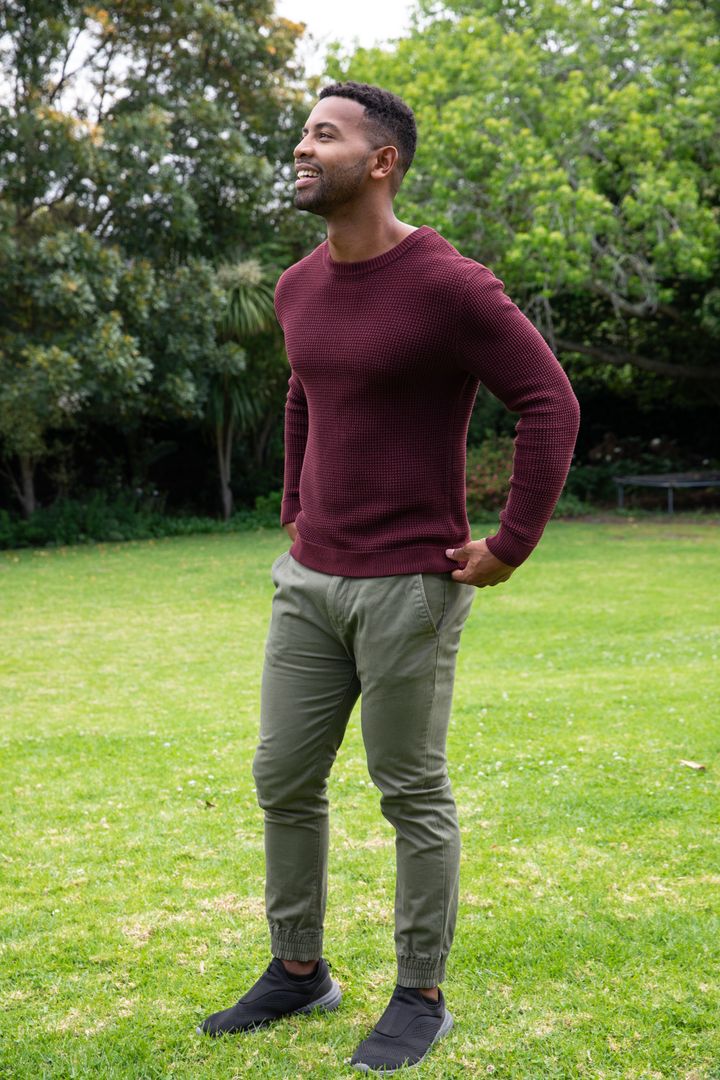 Man in Relaxed Pose Enjoying Serene Garden Environment