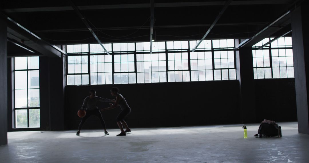 Urban Basketball Game in Empty Building with Natural Light