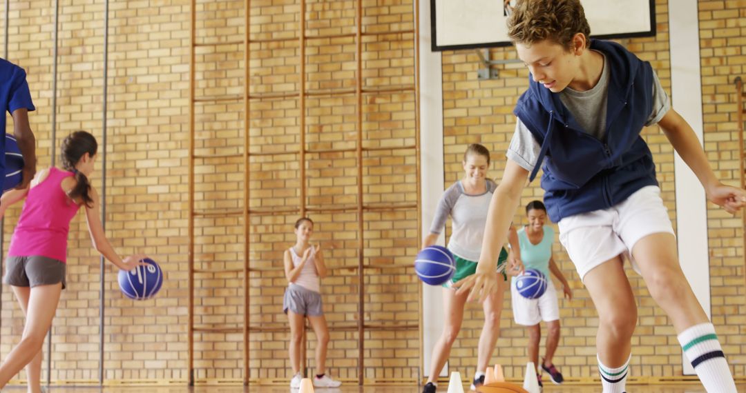 Children Practicing Basketball Dribbling Drills in Gym - Free Images, Stock Photos and Pictures on Pikwizard.com