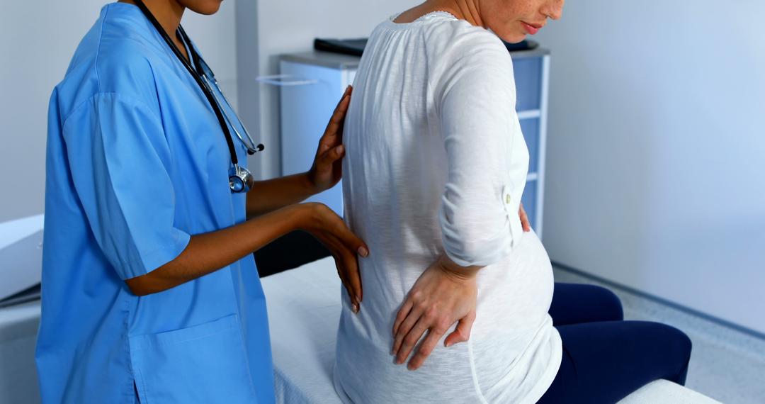 Pregnant Woman Receiving Prenatal Back Exam from Doctor in Clinic - Free Images, Stock Photos and Pictures on Pikwizard.com