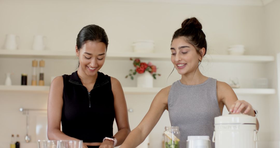Friends Creating Healthy Smoothies in Modern Kitchen