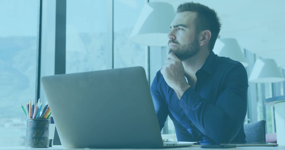 Pensive Businessman Working with Digital Interface