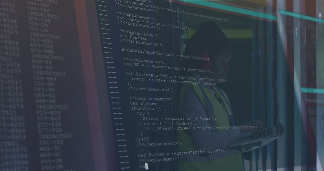 African American Female Worker Analyzing Data in Server Room