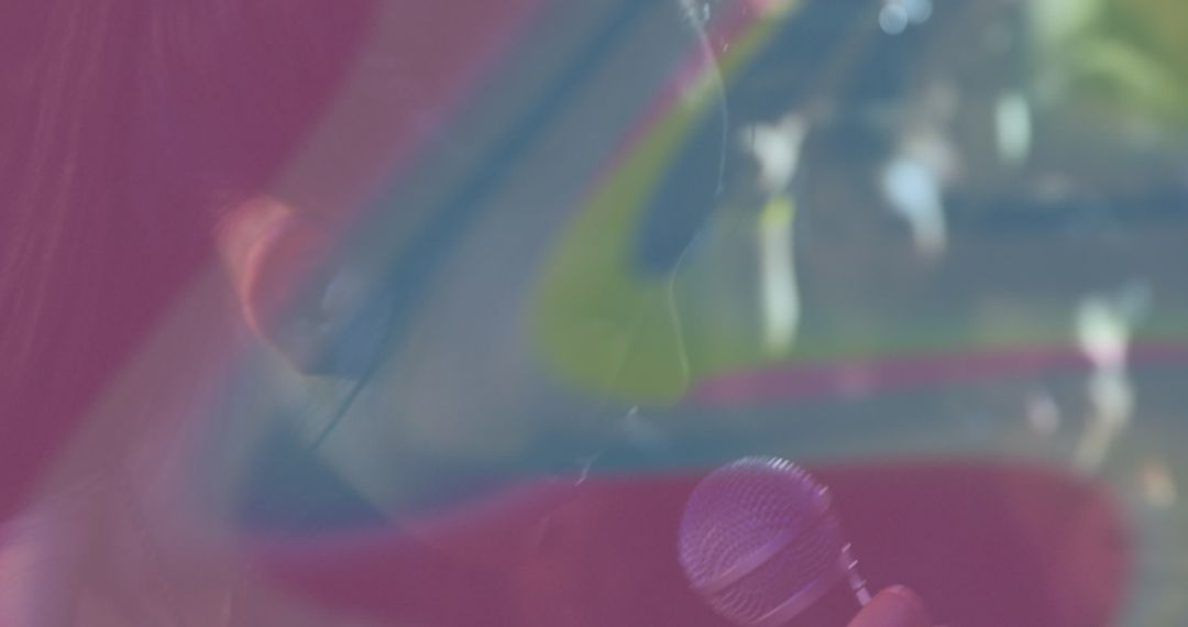 Performer with Microphone Under Vibrant Abstract Lighting