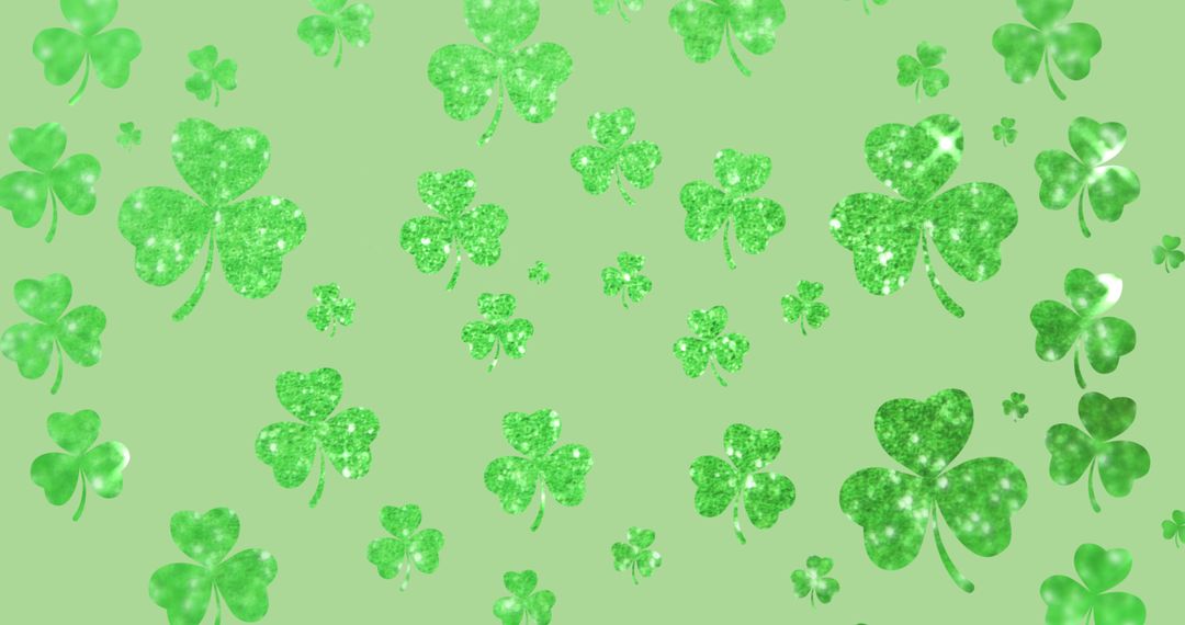Shimmering Green Shamrocks Falling on Light Green Background
