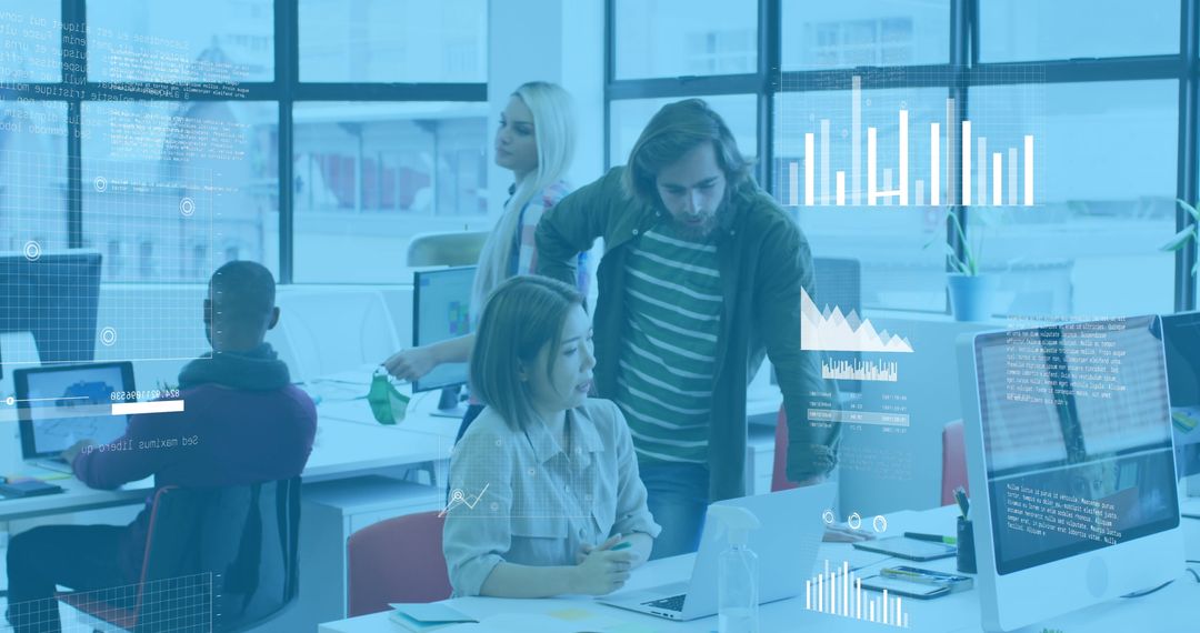 Young Professionals Analyzing Business Data in Modern Office Environment