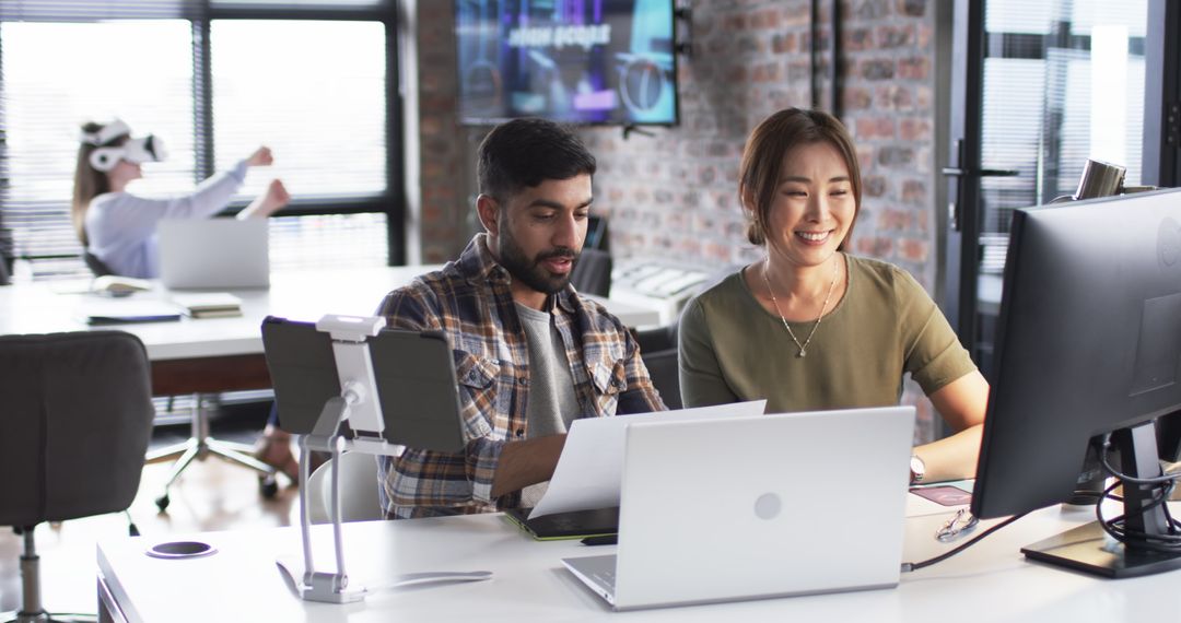 Diverse Team Collaborating in Modern Office with VR Technology