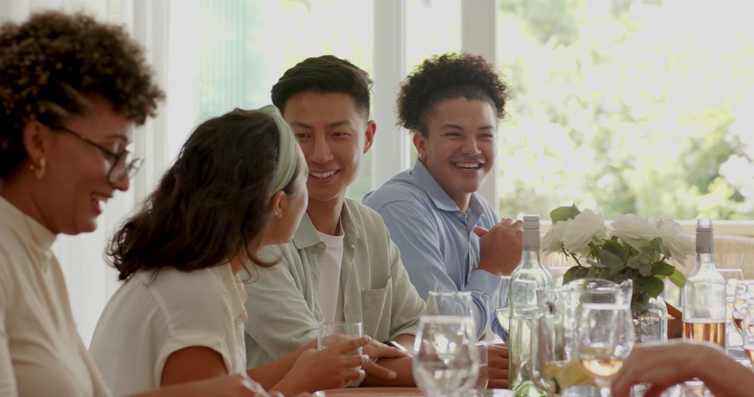 Friends Enjoying Wedding Reception with Toasts and Laughter