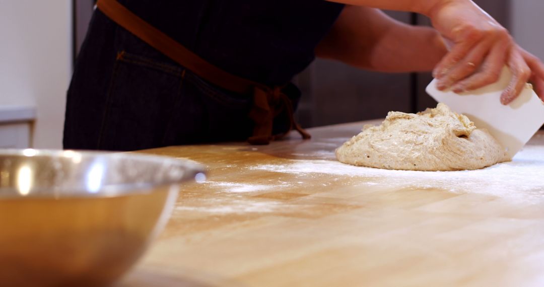 Hands Shaping Dough on Floured Wooden Counter in Kitchen - Free Images, Stock Photos and Pictures on Pikwizard.com