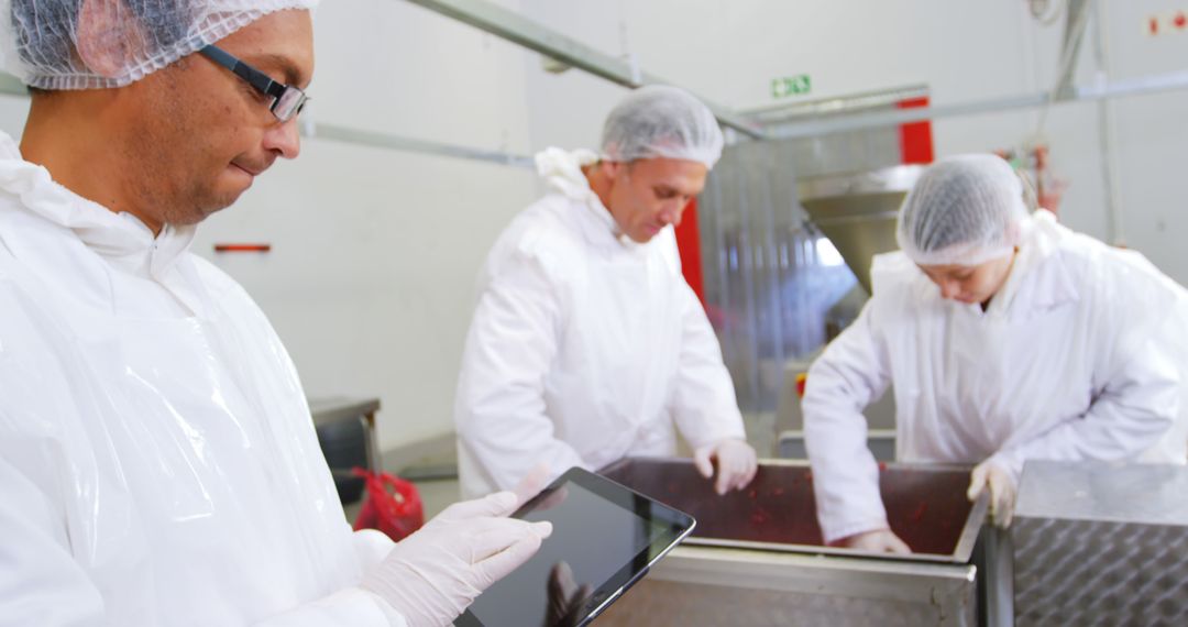 Food Scientists Working in Sanitary Production Facility - Free Images, Stock Photos and Pictures on Pikwizard.com