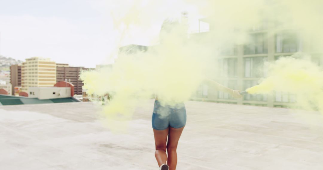 Woman with Color Smoke Bombs on Rooftop - Free Images, Stock Photos and Pictures on Pikwizard.com