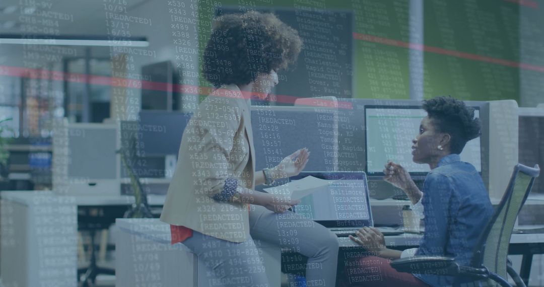 Collaborating Businesswomen Analyzing Data in Modern Office