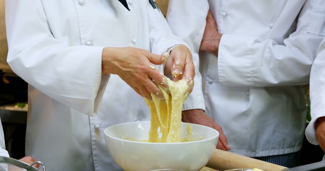 Chefs Kneading Dough in Professional Kitchen - Free Images, Stock Photos and Pictures on Pikwizard.com