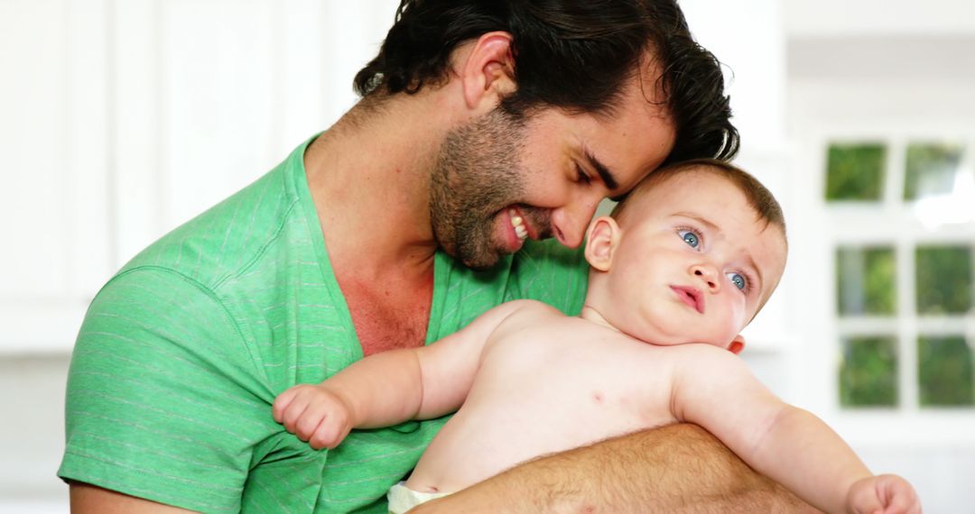 Father Bonding with Baby at Home Showing Emotional Connection