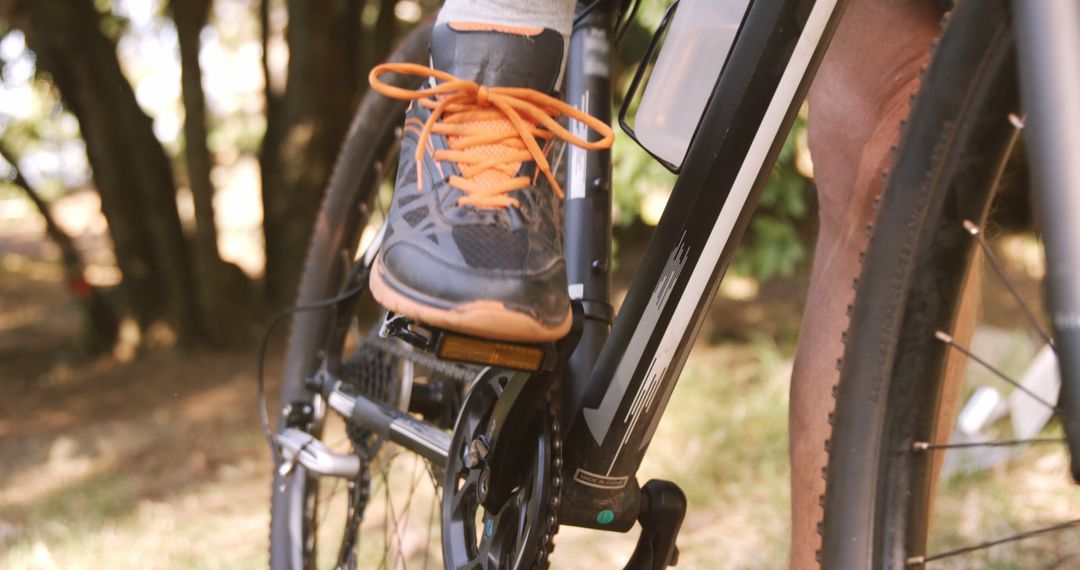 Close-up of Cyclist's Foot on Bicycle Pedal in Outdoor Park - Free Images, Stock Photos and Pictures on Pikwizard.com