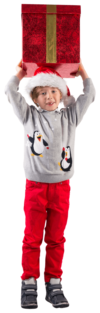Excited Boy Lifts Big Red Gift Box for Christmas Fun