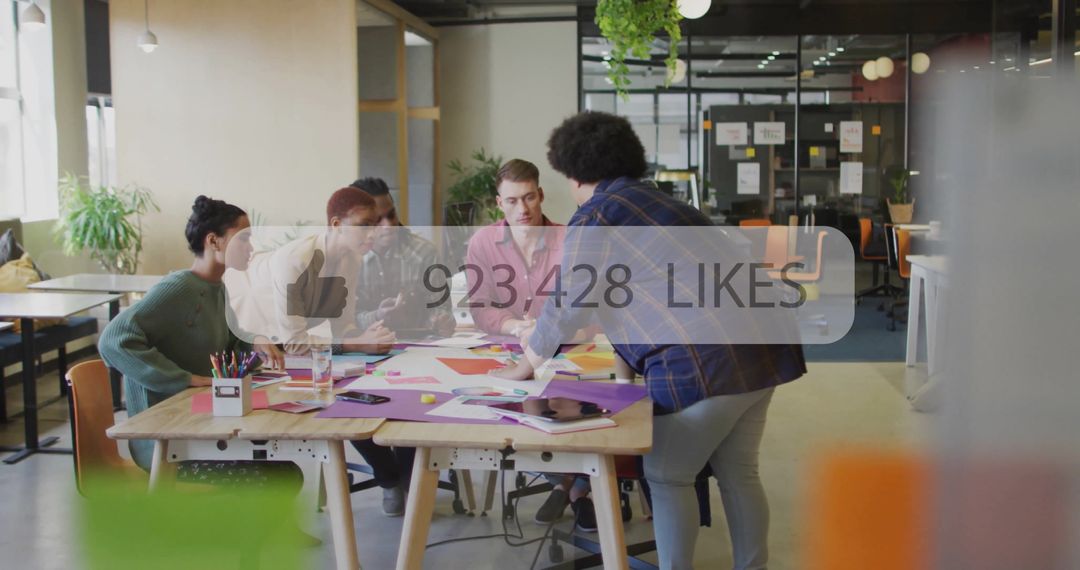 Modern Diverse Team Collaborating on Creative Project with Digital Interface