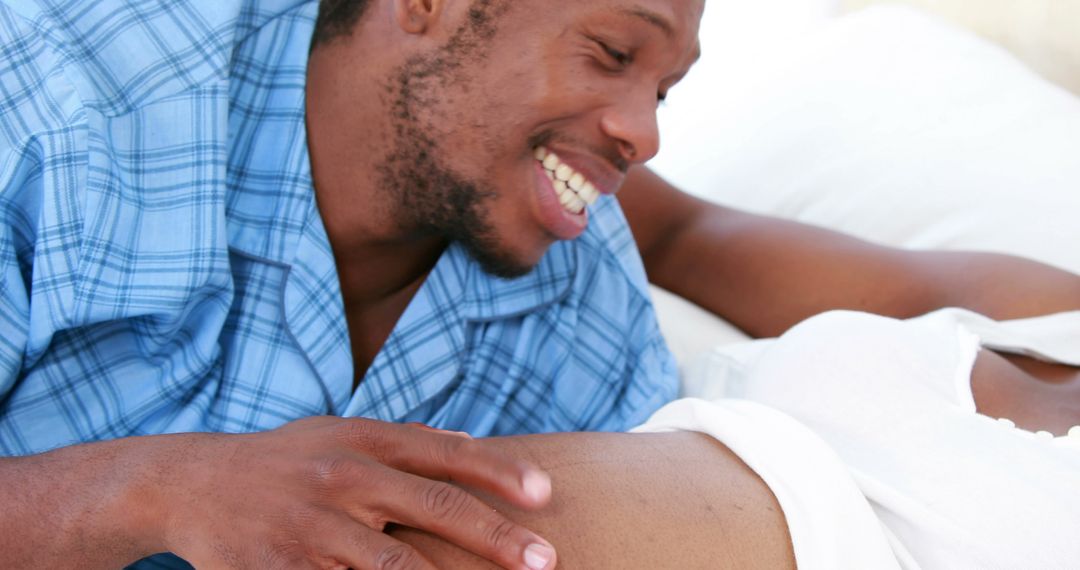 Playful Interaction Between Couple Expressing Joy and Comfort