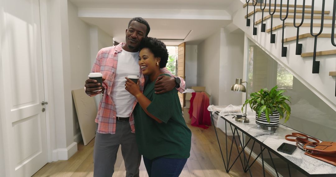 Couple Enjoying Morning Coffee Embrace in Contemporary Home