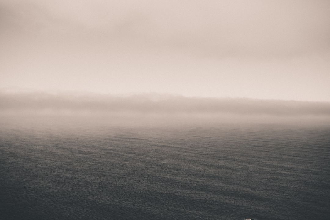 Minimalistic Foggy Horizon Over Calm Sea - Free Images, Stock Photos and Pictures on Pikwizard.com