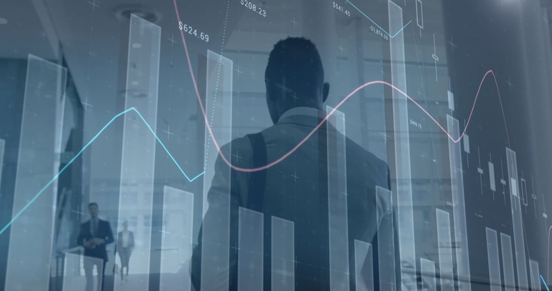 Businessman Analyzing Financial Data with Digital Graphs in Office - Free Images, Stock Photos and Pictures on Pikwizard.com