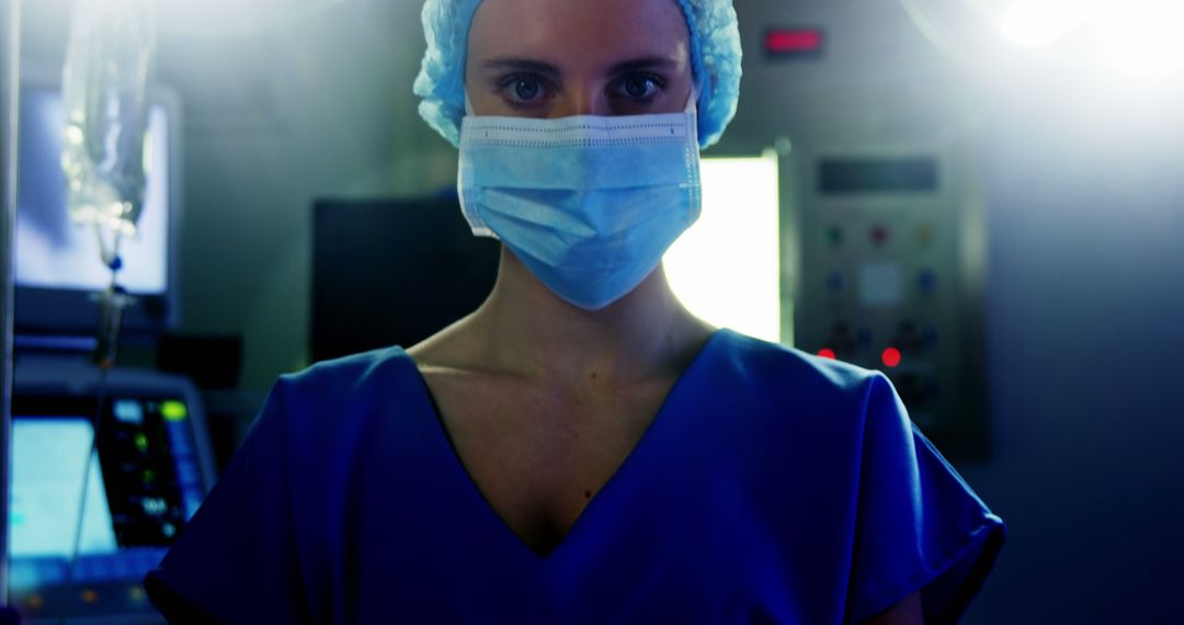 Healthcare Worker Wearing Surgical Mask and Scrubs in Hospital - Free Images, Stock Photos and Pictures on Pikwizard.com