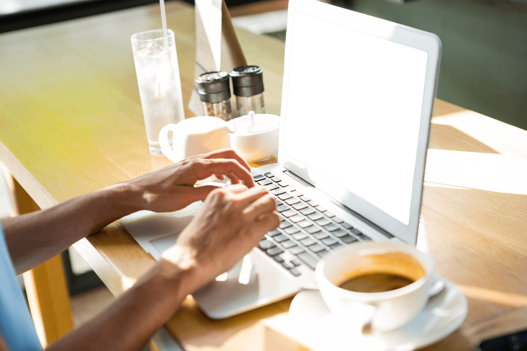 Transparent Laptop Use in Modern Cafe with Household Items