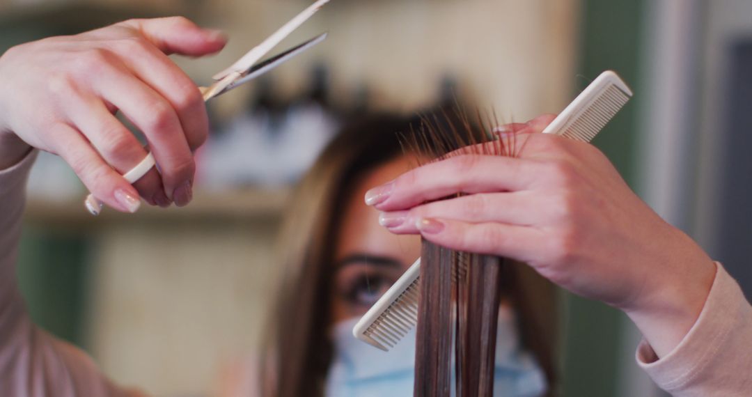 Hairdresser Trimming Client's Hair with Scissors and Comb in Salon - Free Images, Stock Photos and Pictures on Pikwizard.com