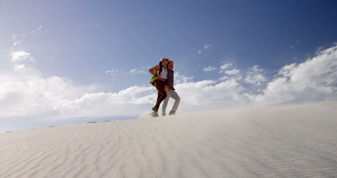 Adventurous Hiker Traversing Desert Dunes