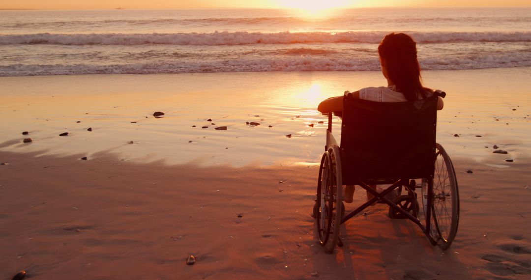 Woman in Wheelchair Watching Sunset on Beach - Free Images, Stock Photos and Pictures on Pikwizard.com