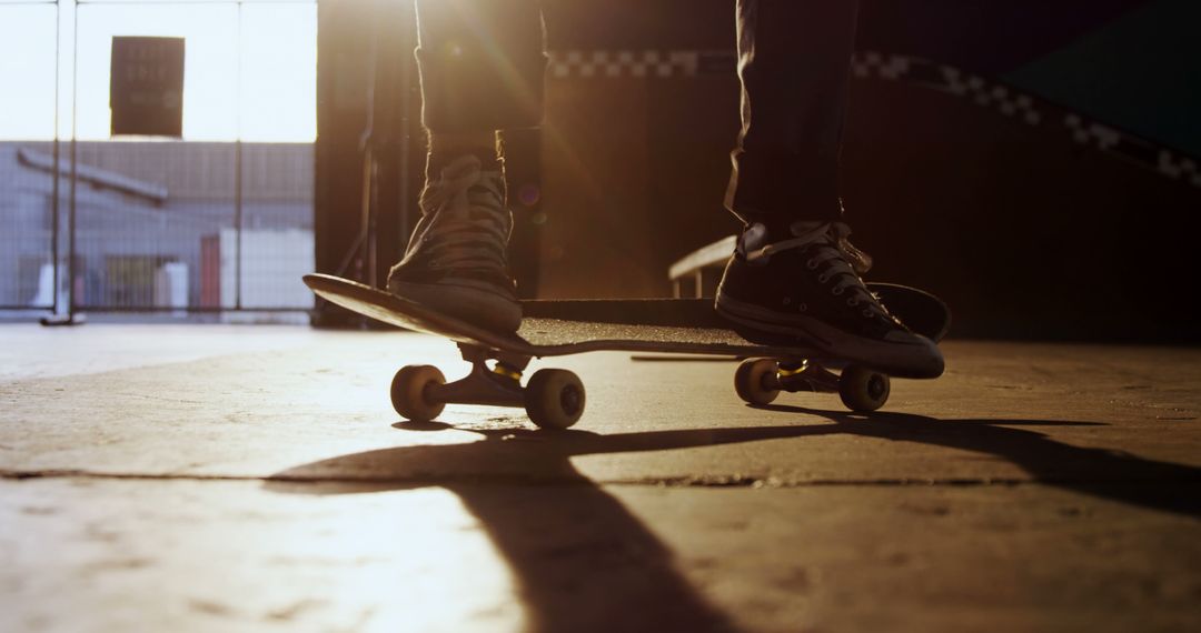 Silhouette of Skateboarders Practicing Indoors at Sunset - Free Images, Stock Photos and Pictures on Pikwizard.com