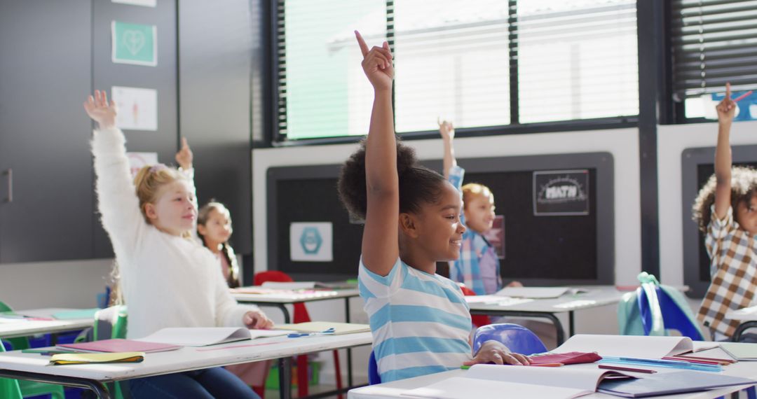 Diverse Group of Schoolchildren Raising Hands in Classroom - Free Images, Stock Photos and Pictures on Pikwizard.com