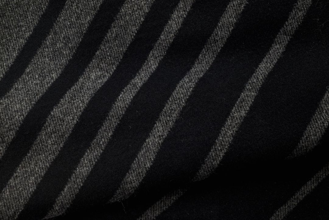 Dark Diagonal Wool Fabric Texture with Soft Black and Gray Stripes for Stylish Backgrounds