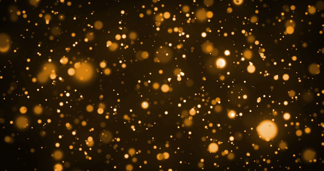 Golden Bokeh Particles Against Dark Backdrop