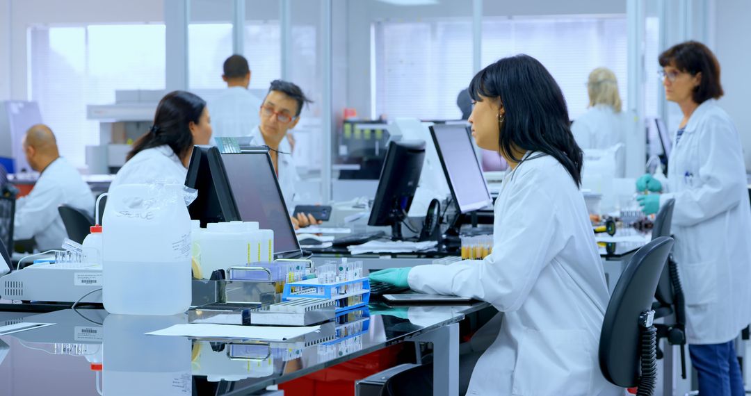 Scientists Analyzing Data in Modern Laboratory Setting - Free Images, Stock Photos and Pictures on Pikwizard.com