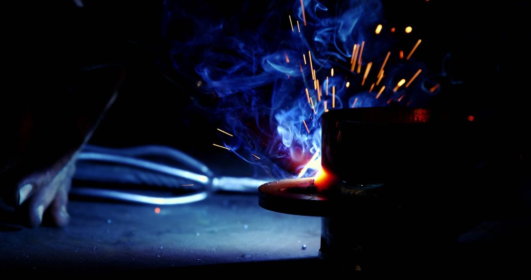 Industrial Welding Sparks in Dark Workshop - Free Images, Stock Photos and Pictures on Pikwizard.com