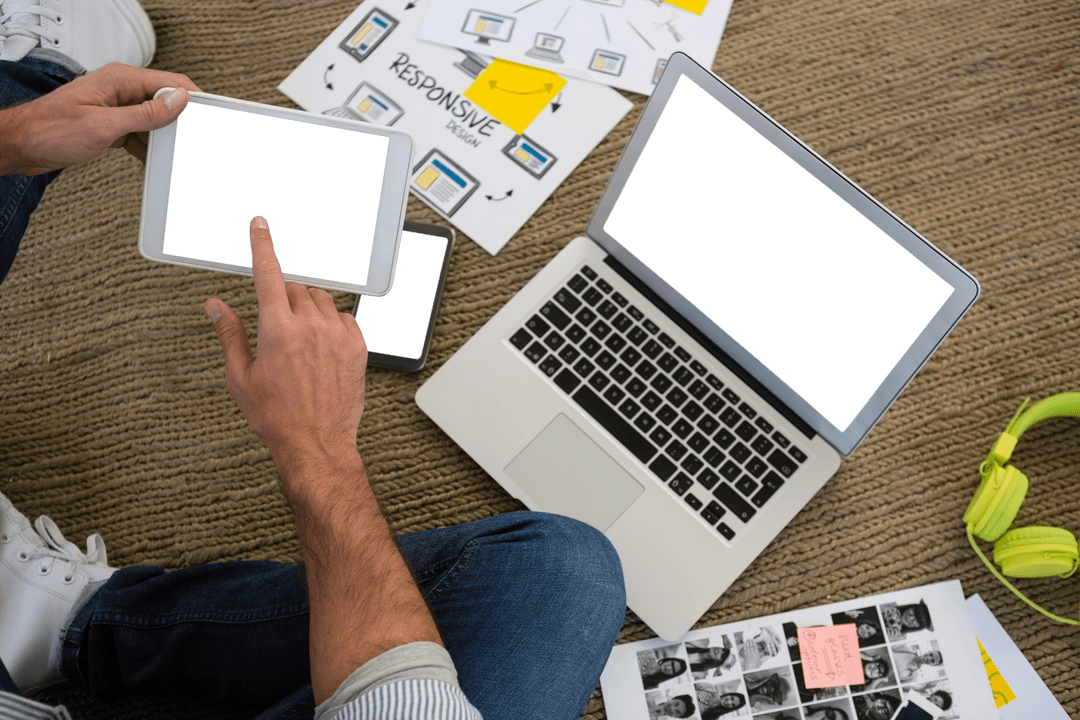 Designer using digital tablet in creative workspace with transparent screens