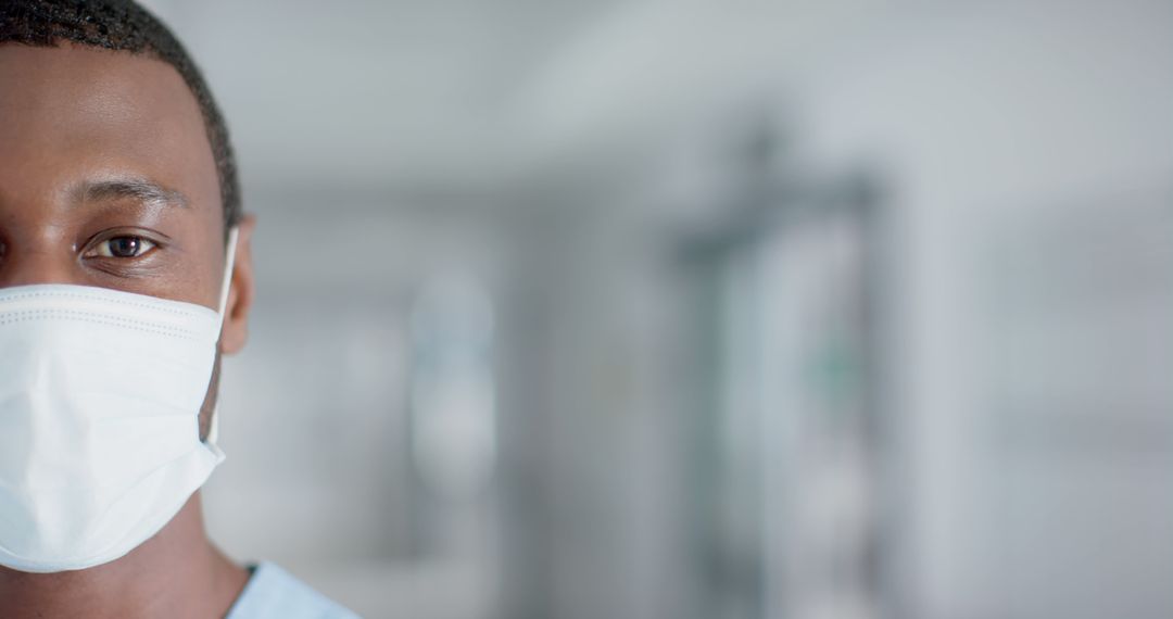 Close-up of Healthcare Worker Wearing Facemask in Hospital - Free Images, Stock Photos and Pictures on Pikwizard.com