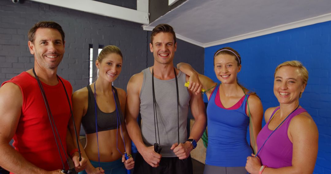 Group of Fit Adults and Teen Smiling with Jump Ropes in Gym - Free Images, Stock Photos and Pictures on Pikwizard.com