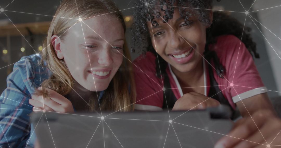 Women Collaborating on Technology with Digital Connections Overlay