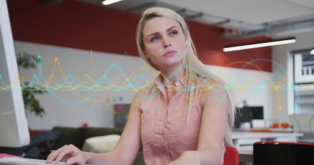 Tech Savvy Woman Coding in Modern Office with Abstract Waveform Graphics