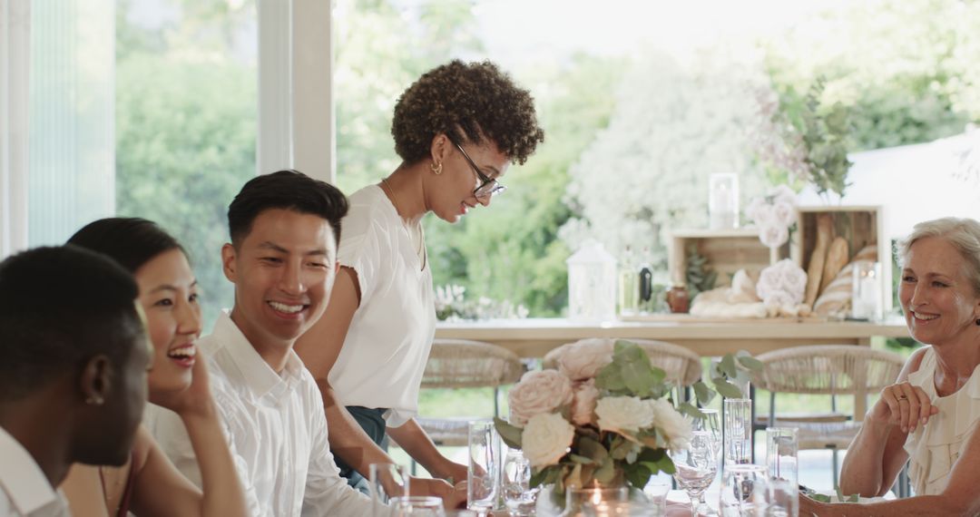 Elegant Wedding Reception Conversation with Guests at Table