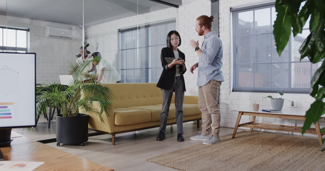 Diverse Coworkers Engaging in Office Collaboration with Technology