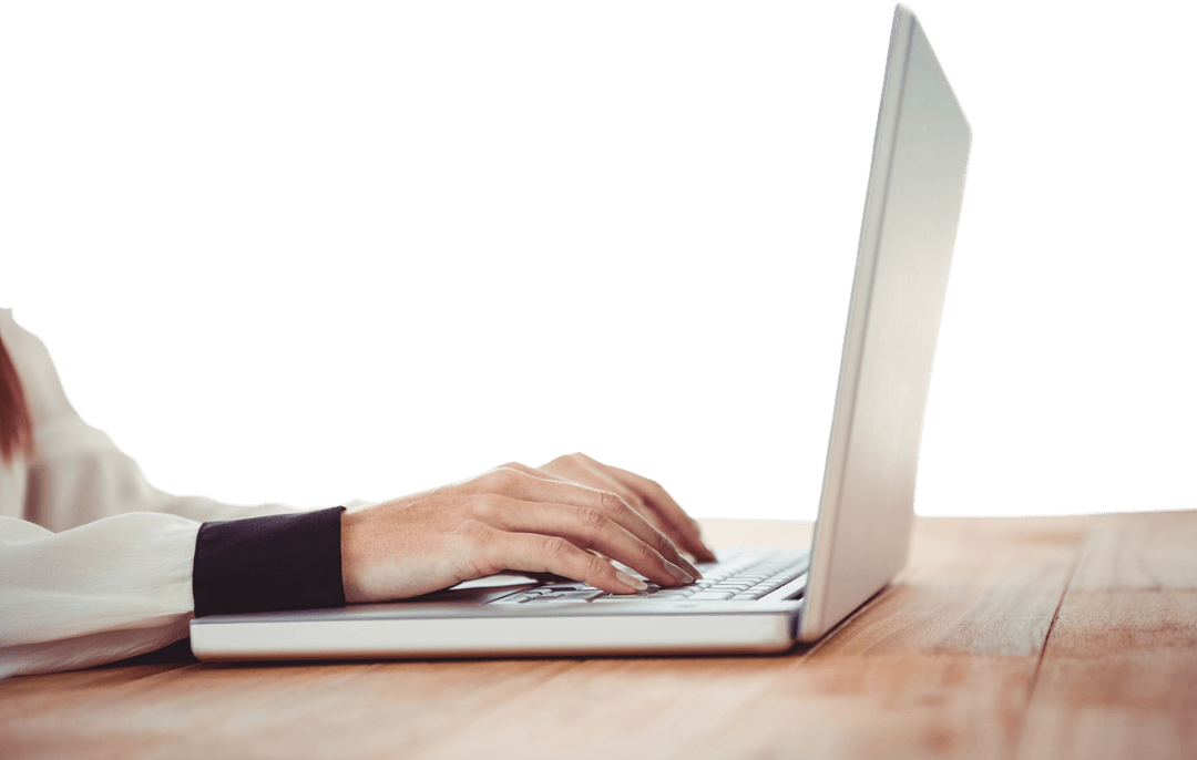 Transparent View of Hands Typing on Laptop at Wooden Desk